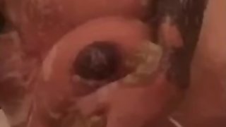 Petite teen gets horny in the shower