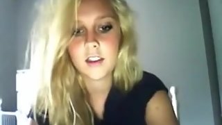 Gorgeous amateur blonde undresses in her room