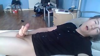 fit young guy shoots cum from his thick uncut cock