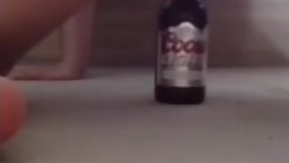 Young teen girl fucks beer bottle