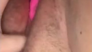 Playing with her unshaven pussy