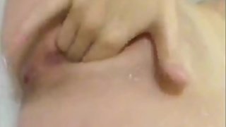 Teen Fingering Herself in a Bathtub