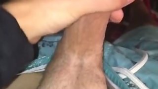 Cock gets stroked in bed